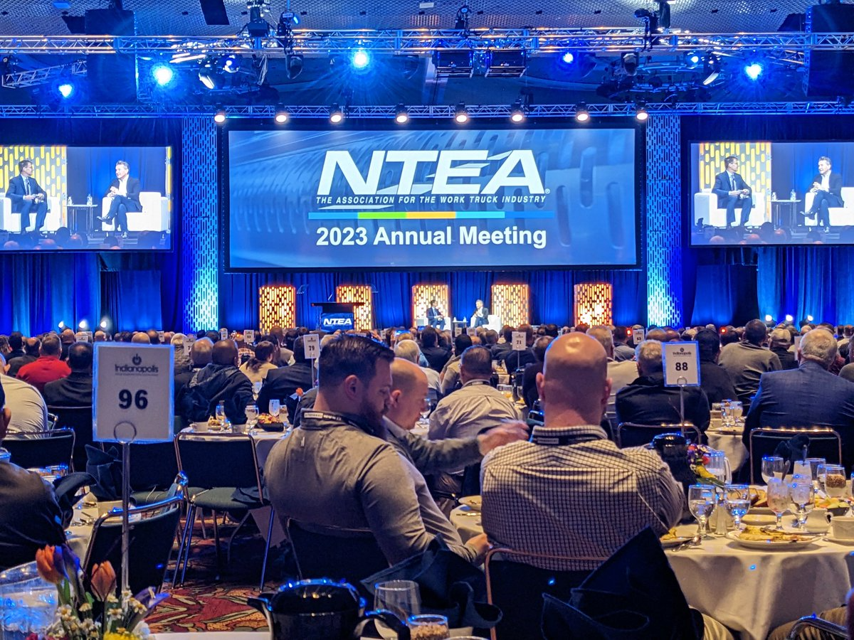 David Scheitlin (on stage, left) interviews Shark Tank's Robert Herjavec at the NTEA's Annual Meeting.