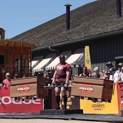 A competitor in the World's Strongest Man competition deadlifts two Knaack storage boxes. A competitor in the World's Strongest Man competition deadlifts two Knaack storage boxes.