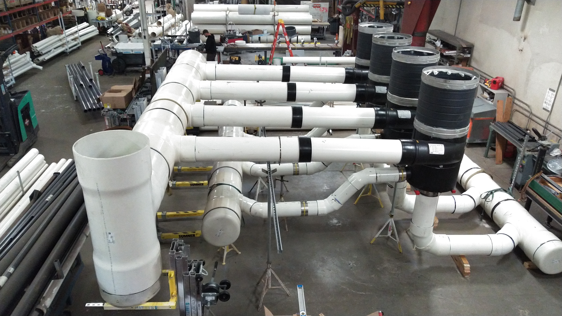A large prefabricated piping assembly for the Minneapolis Bus Garage job. Note the worker in back for scale.