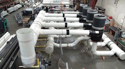 A large prefabricated piping assembly for the Minneapolis Bus Garage job. Note the worker in back for scale. A large prefabricated piping assembly for the Minneapolis Bus Garage job. Note the worker in back for scale.