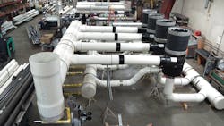 A large prefabricated piping assembly for the Minneapolis Bus Garage job. Note the worker in back for scale. A large prefabricated piping assembly for the Minneapolis Bus Garage job. Note the worker in back for scale.