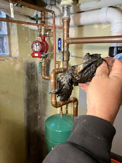 Old shop towel looking much the worse after its travels through the system. Old shop towel looking much the worse after its travels through the system.