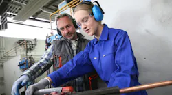 Plumbing apprentice in training.