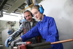 Plumbing apprentice in training. Plumbing apprentice in training.