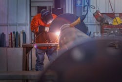 An AZCO technician working on a helical pile in the company's fabrication shop. An AZCO technician working on a helical pile in the company's fabrication shop.