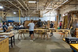 The Alley House team hard at work in their prefabrication facility. The Alley House team hard at work in their prefabrication facility.