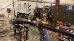 A Haberberger technician welds a section of cast iron pipe at the company&apos;s new piping facility.