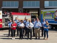 Members of the Williams Comfort Air and the Mr. Plumber team pose alongside members of the Indianapolis Fire Department.