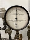 Pat Linhardt&apos;s favorite steam gauge from his personal collection. Ounces to the right of zero, inches of water column of vacuum to the left of zero.