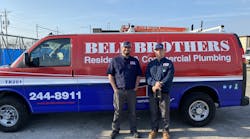 Two company technicians in front of a Bell Brothers service van. Two company technicians in front of a Bell Brothers service van.