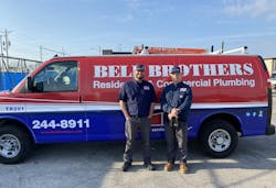 Two company technicians in front of a Bell Brothers service van. Two company technicians in front of a Bell Brothers service van.