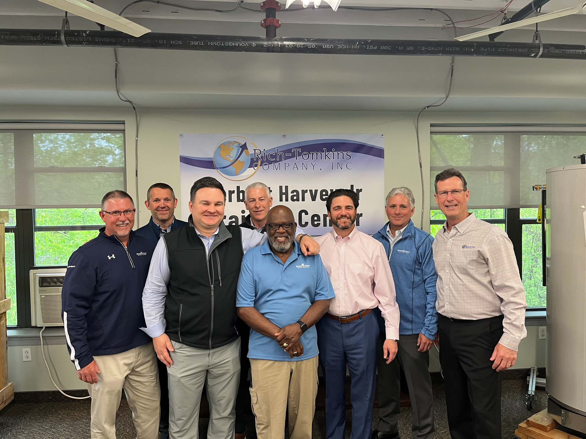 Honoree Herbert Harvey Jr. posing with proud Bradford White and Rich-Tomkins Company leaders celebrating his hard work.