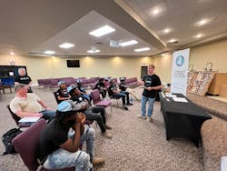 High school students attend a training session. High school students attend a training session.