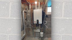 The finished tankless installation. The Sanicondens Best Flat unit can be seen underneath the Navien unit, just above the expansion tank. The finished tankless installation. The Sanicondens Best Flat unit can be seen underneath the Navien unit, just above the expansion tank.