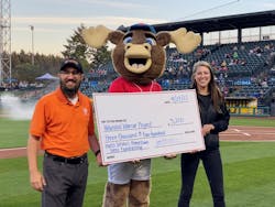 Steve Kochaniec from Harts Services presents a check on the field to Madison Strunk with the Wounded Warrior Project. Steve Kochaniec from Harts Services presents a check on the field to Madison Strunk with the Wounded Warrior Project.