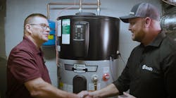 Gerry Winset of A.O. Smith (right) shakes hands with Carl (left), a tech working with W. L. Staton Plumbing, Cooling & Heating, in front of a Voltex hybrid electric heat pump water heater. Gerry Winset of A.O. Smith (right) shakes hands with Carl (left), a tech working with W. L. Staton Plumbing, Cooling & Heating, in front of a Voltex hybrid electric heat pump water heater.