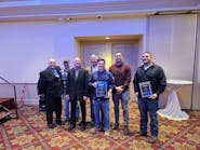 Manhattan Mechanical&rsquo;s Nate Hassett, Rick Coleman, Glen Moody, Mike Uremovich, Joe Harkness, Tim Boreman, and Tim Cvitanovich holding the Platinum and Gold awards at the TRMA Annual Awards Gala.