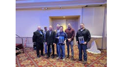 Manhattan Mechanical&rsquo;s Nate Hassett, Rick Coleman, Glen Moody, Mike Uremovich, Joe Harkness, Tim Boreman, and Tim Cvitanovich holding the Platinum and Gold awards at the TRMA Annual Awards Gala.