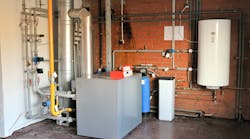 A residential gas boiler with storage tank. A residential gas boiler with storage tank.