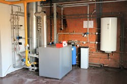 A residential gas boiler with storage tank. A residential gas boiler with storage tank.