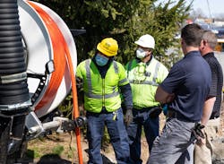 Workers wearing their PPE at the vacuum truck. To prevent free spooling the nozzle up the line and losing control, use a nozzle skid and hold the nozzle back. Workers wearing their PPE at the vacuum truck. To prevent free spooling the nozzle up the line and losing control, use a nozzle skid and hold the nozzle back.