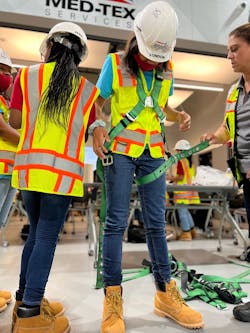MyWIC attendees learn the basics of construction site safety. MyWIC attendees learn the basics of construction site safety.