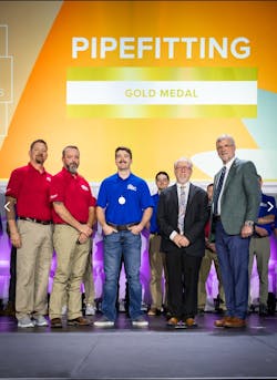 Tristian Wright (center) proudly wearing his gold medal in pipefitting from the 2023 National Craft Championships. Tristian Wright (center) proudly wearing his gold medal in pipefitting from the 2023 National Craft Championships.