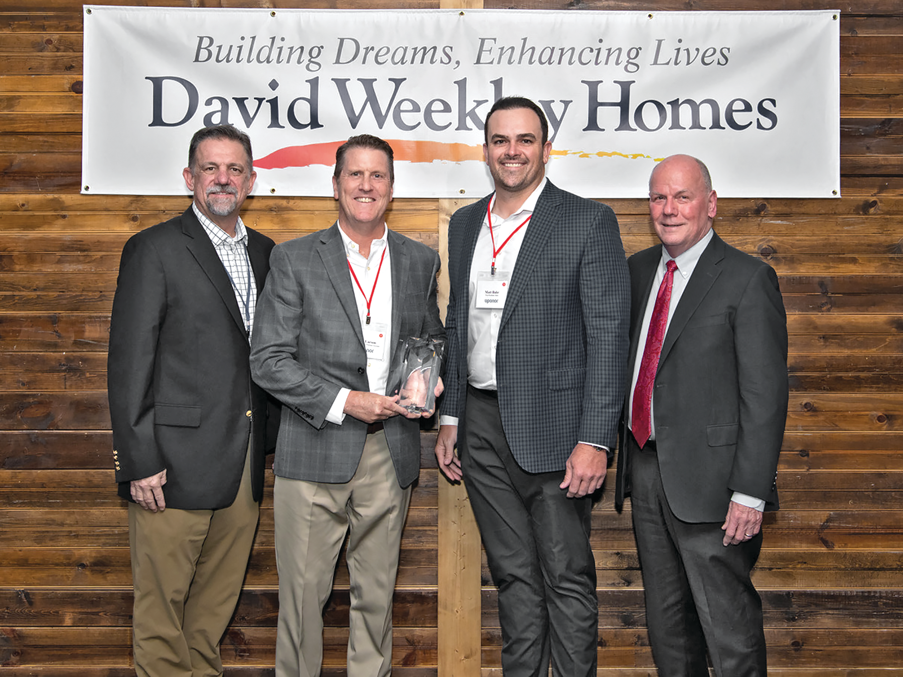 Shown from left: John Schiegg, vice president, Supply Chain Services, David Weekley Homes; Robert Larson, director, Sales National Accounts, Uponor; Matt Bahr, VP, Sales, Uponor; and John Johnson, CEO, David Weekley Homes.