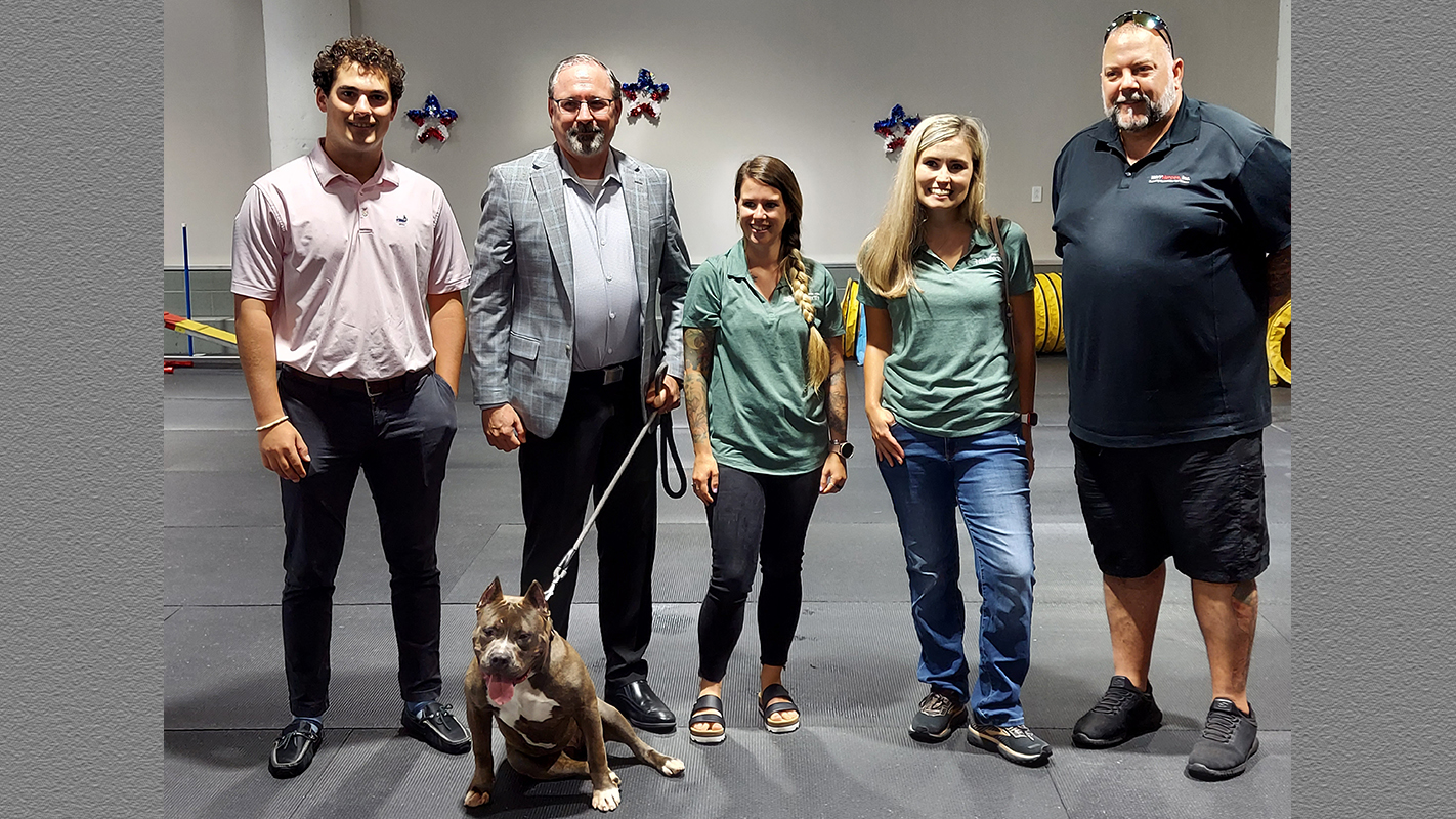 Piper poses with members of the J. W. Danforth team.