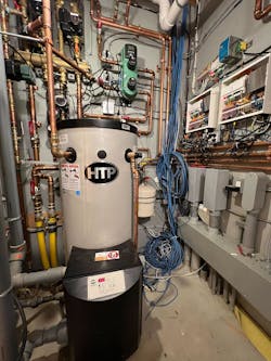 The system also includes an HTP Phoenix high-efficiency water heater as a backup for the heating side of the house. The Phoenix has a 96 percent thermal efficiency rating. The system also includes an HTP Phoenix high-efficiency water heater as a backup for the heating side of the house. The Phoenix has a 96 percent thermal efficiency rating.