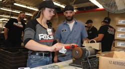 An Experience winner builds their own iconic RIDGID customized pipe wrench during the factory tour. An Experience winner builds their own iconic RIDGID customized pipe wrench during the factory tour.