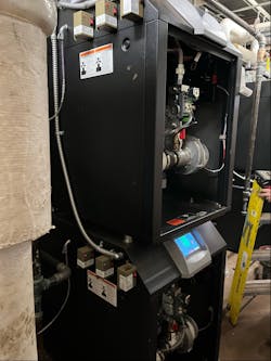 One of the Elite boilers with its service cover off.