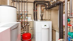 Household boiler room with heat pump, storage tank and circulators. Household boiler room with heat pump, storage tank and circulators.