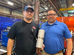 Shane Shook (left) and Robert Derby pose with a product of the new welding procedure. Shane Shook (left) and Robert Derby pose with a product of the new welding procedure.