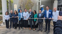 Uponor North America President Andres Caballero cuts the plastic pipe 'ribbon' to open the company's new Experience Center. Uponor North America President Andres Caballero cuts the plastic pipe 'ribbon' to open the company's new Experience Center.