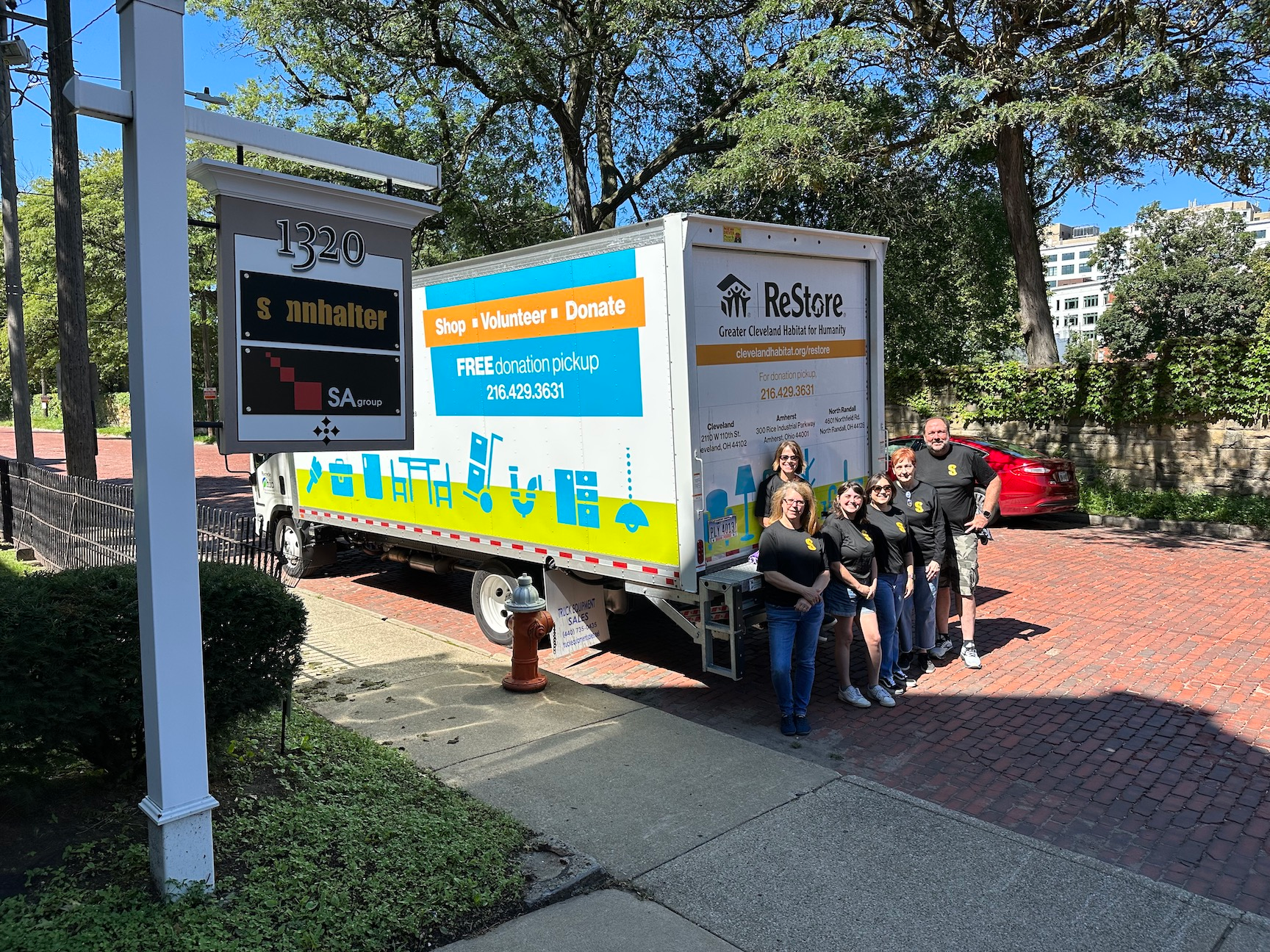 The Sonnhalter crew with a truck full of donated tools and materials.