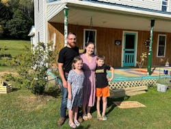 The Dittman family pose in front of their 1903 house. The Dittman family pose in front of their 1903 house.