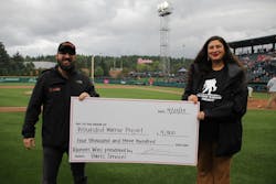 Richard Hart presents a check for the Wounded Warrior Project at a Tacoma Rainiers game. Richard Hart presents a check for the Wounded Warrior Project at a Tacoma Rainiers game.