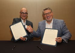Roman Feher and Dave Viola at the signing ceremony. Roman Feher and Dave Viola at the signing ceremony.