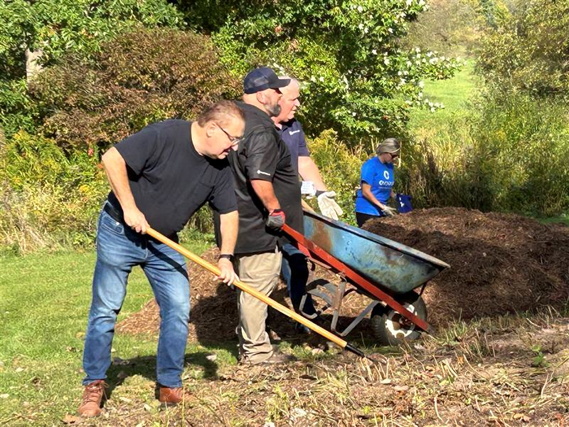 Volunteers helping dig the new well.