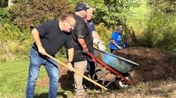 Volunteers helping dig the new well. Volunteers helping dig the new well.