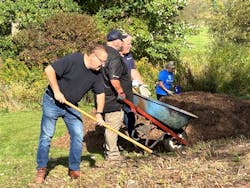 Volunteers helping dig the new well. Volunteers helping dig the new well.