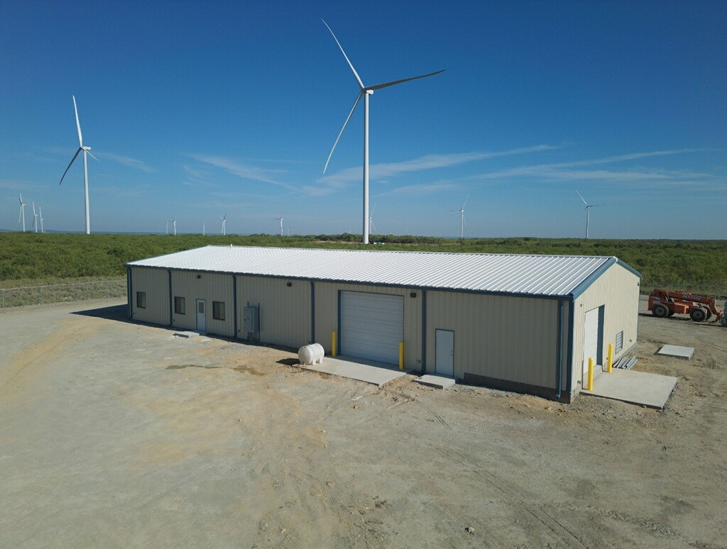 A few wind turbines and the operations center at Century Oak.