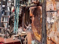A rear view of the boiler while removing the walling and insulation. A rear view of the boiler while removing the walling and insulation.