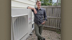 Homeowner Ryan Kelly with his new heat pump.