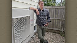 Homeowner Ryan Kelly with his new heat pump. Homeowner Ryan Kelly with his new heat pump.