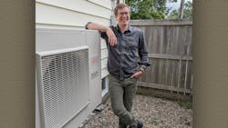 Homeowner Ryan Kelly with his new heat pump. Homeowner Ryan Kelly with his new heat pump.