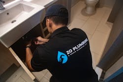 Zo Plumbing Tech Working On Job