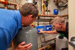 Gillette (left) and Armstrong change setpoints on the homes tekmar control system. Gillette (left) and Armstrong change setpoints on the homes tekmar control system.