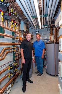 Armstrong (left) and Gillete, in the mechanical room below the terraces. Armstrong (left) and Gillete, in the mechanical room below the terraces.